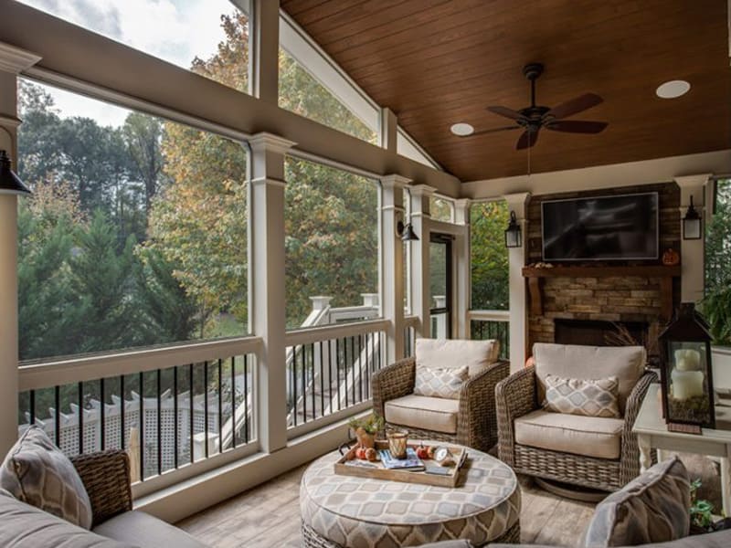 A cozy screened back porch designed by Exterior Design + Decks in Woodstock, GA.