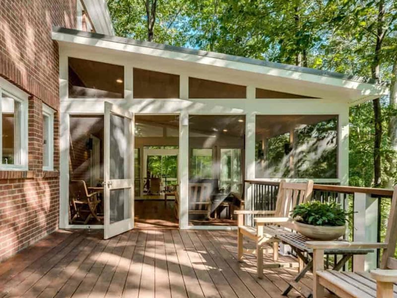 An elegant screened porch was installed by Exterior Design + Decks in Woodstock, GA.